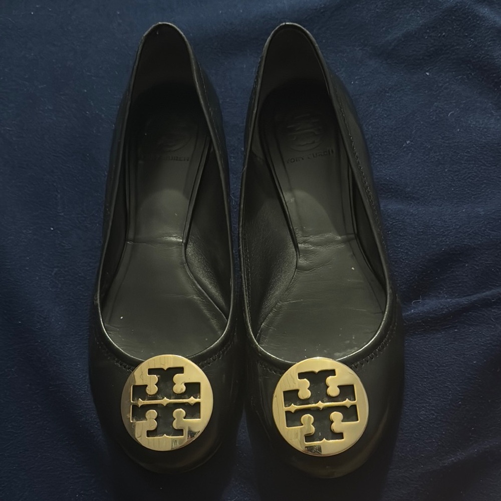 Chic Black Flats with Gold Emblem